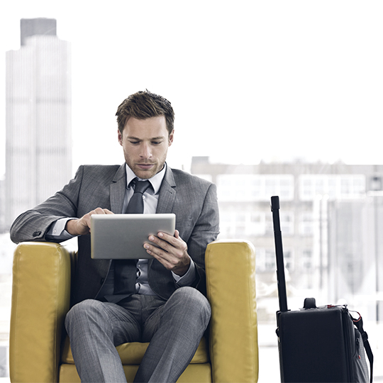 man and woman working on laptop